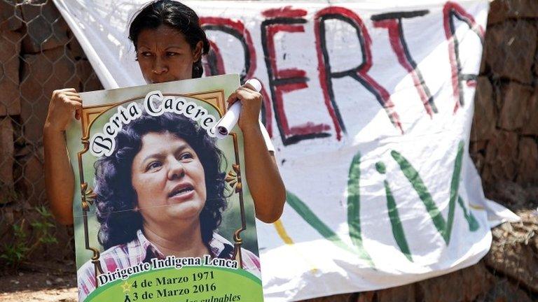 Lenca indigenous woman holding a picture of Caceres, 18 March 2016