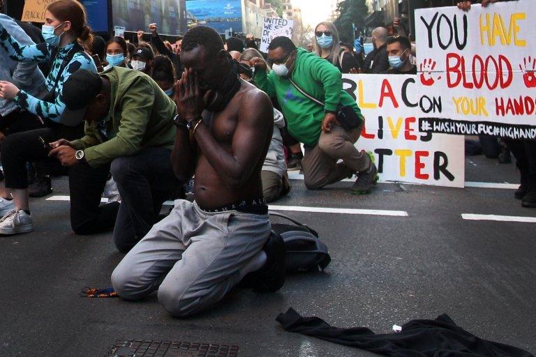 People kneeled in vigils in Sydney, Australia