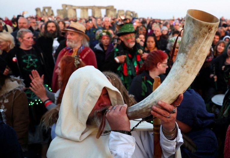 man blowing horn