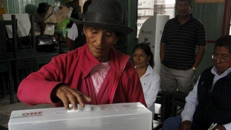 Woman casts vote in first round of presidential election