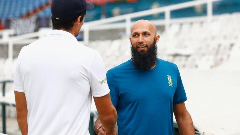 Hashim Amla shakes Alastair Cook's hand after the match