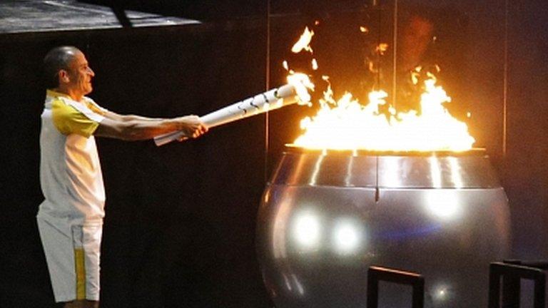 Vanderlei de Lima lights the Olympic flame