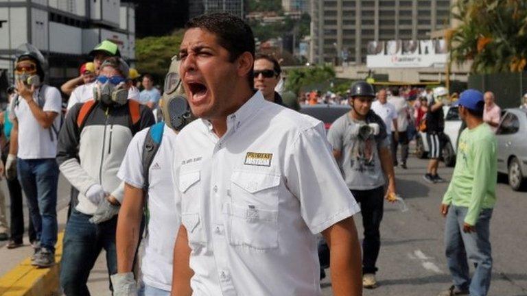 Opposition lawmaker Jose Manuel Olivares (C) shouts next to others, as they clash with riot security forces during a protest against Venezuelan President Nicolas Maduro's government in Caracas, Venezuela June 5, 2017.