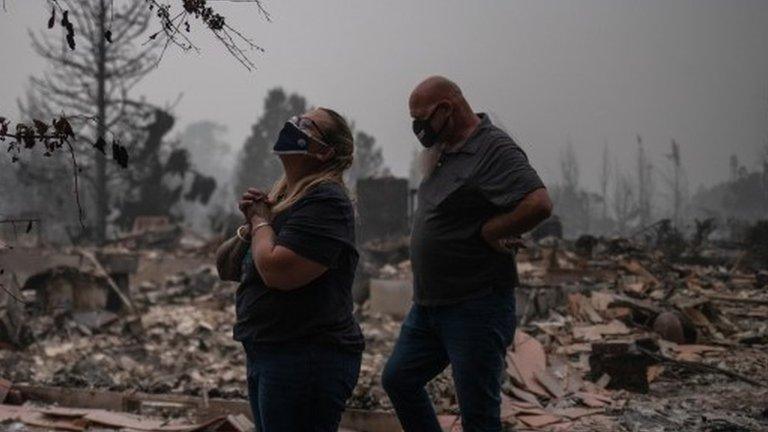 Couple in the remains of their home in Talent, Oregon