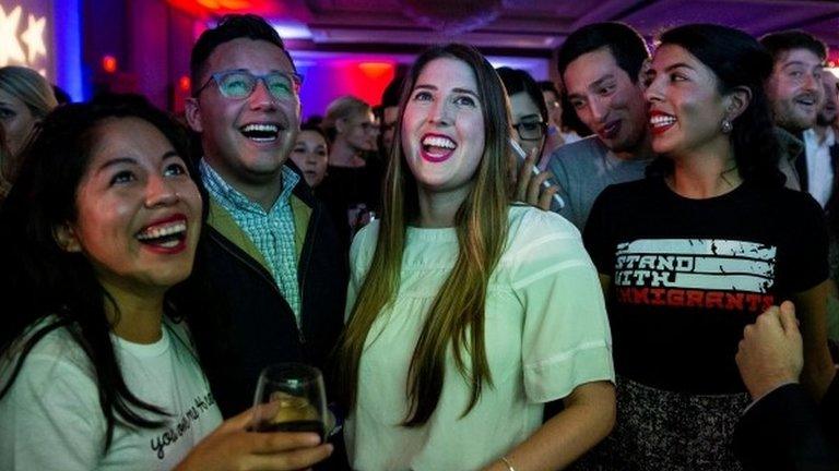 Democrats cheer election results at a late-night party in Washington, 7 November