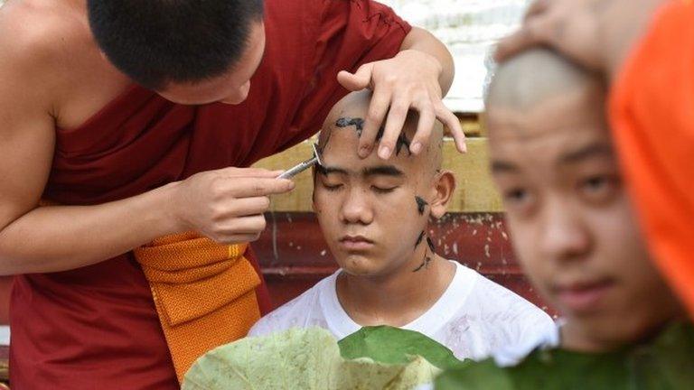 Buddhist monks shave the hair of the rescued Thai boys and members of "Wild Boars" football team together with their coach at the Phra That Doi Wao Buddhist temple in the Mae Sai district of Chiang Rai province during the religious ordination ceremony on July 24, 2018.