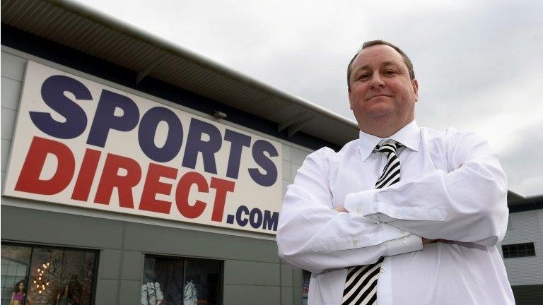 Mike Ashley outside warehouse