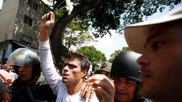 In this file photo from 18 February 2014, opposition leader Leopoldo Lopez is flanked by Bolivarian National Guards after Lopez surrendered in Caracas, Venezuela