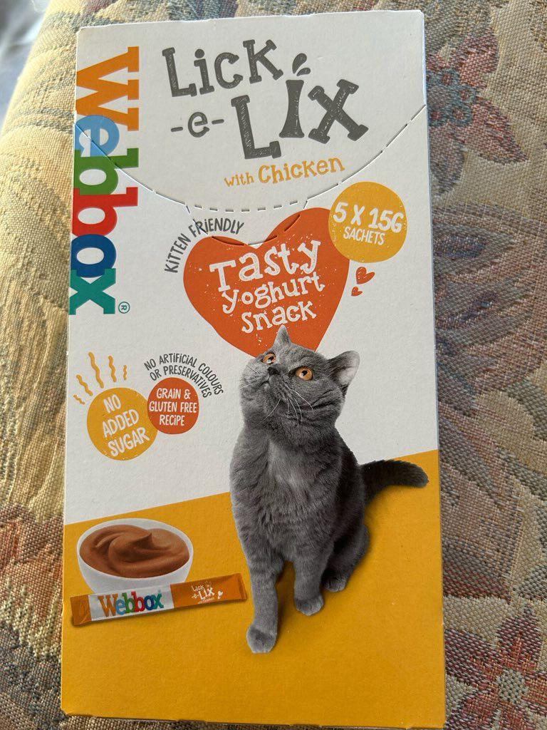 Photo of packet of cat treats Mr Long brought from the B&M store. the packet shows a grey cat who is sat and looking up, next to an imagine of the cat treat. The top of the packet reads 'lick -e- lix'.
