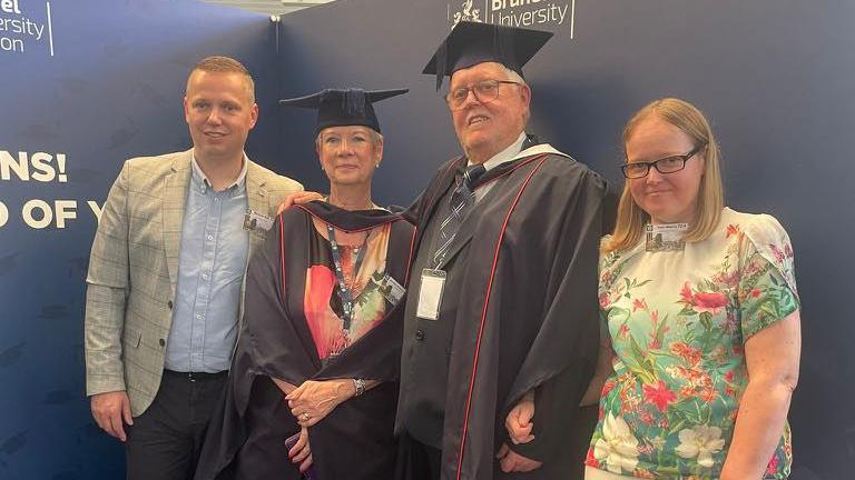 Michael Ball, Jan Ball, Ian Ball and Helen Maberly posing for a photo at a Brunel University honorary degree ceremony ents r