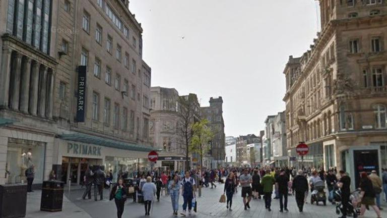 Crowds of people walking along Church Street next to Primark in Liverpool city centre.