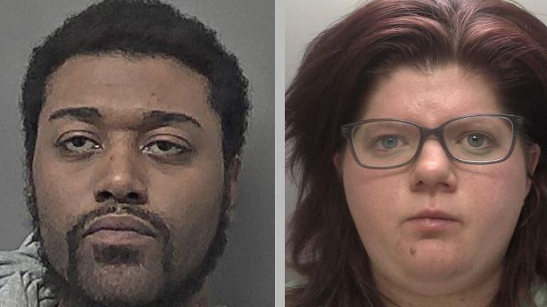 A custody photo of a man with black hair and a black beard on the left. A custody photo of a woman with red hair and glasses on the right. 