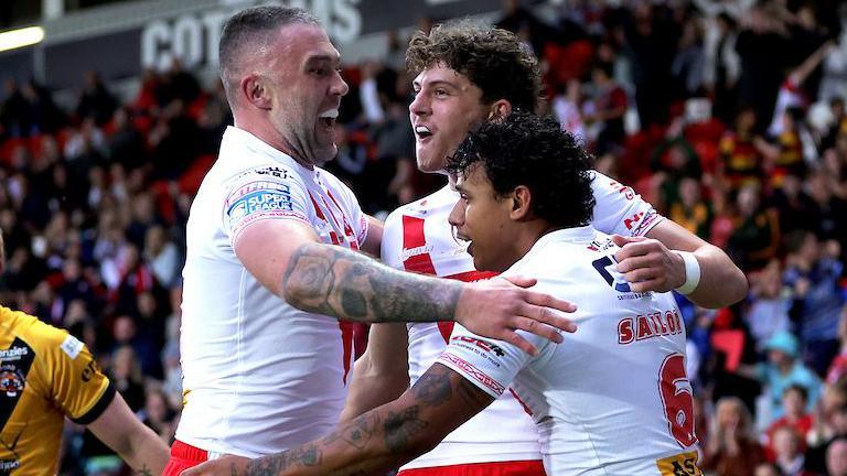 St Helens player Owen Dagnall is congratulated by teammates after scoring a try against Castleford Tigers.