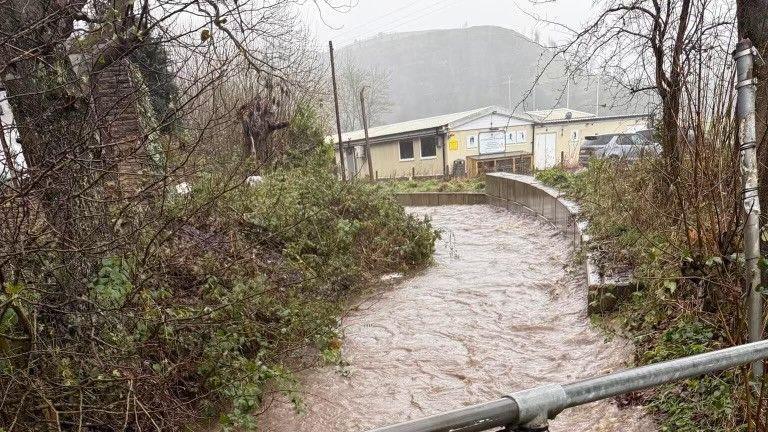 Photograph of a brook overflowing due to heavy rainfall and snow-melt during Storm Bert, 23 November.