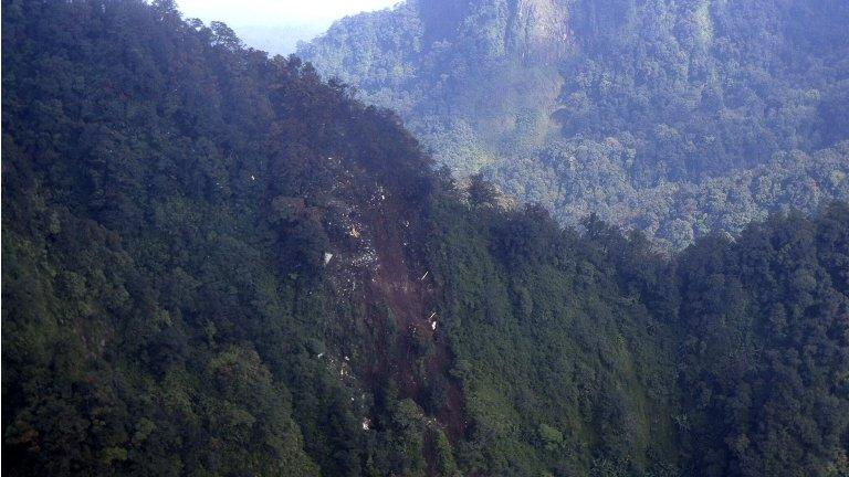 In photo released by Indonesian Air Force the wreckage of a missing Sukhoi Superjet-100 is seen scattered in Bogor, Indonesia, on 10 May 2012