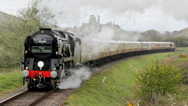 Steam train passes Corfe Castle