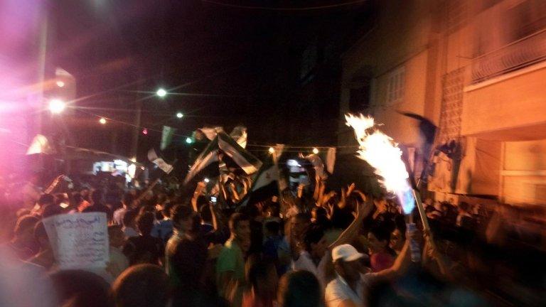 Syrians demonstrate in the town of Deir al-Zor in a handout picture released by Shaam News Network 3 June 2012