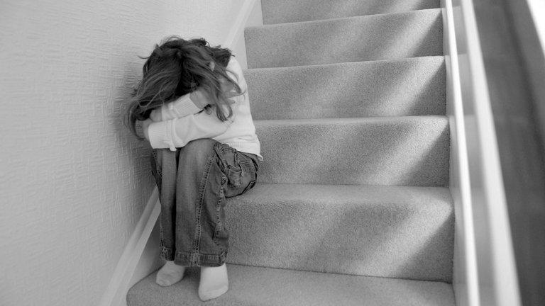 Child sitting on stairs