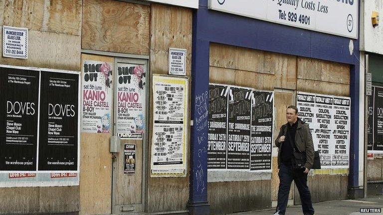 A run-down street with closed shops in Altrincham, northern England