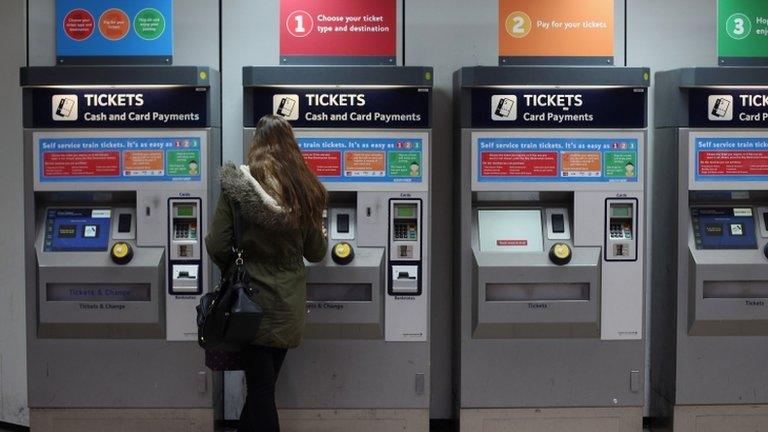 Lady buys a ticket at Clapham Junction