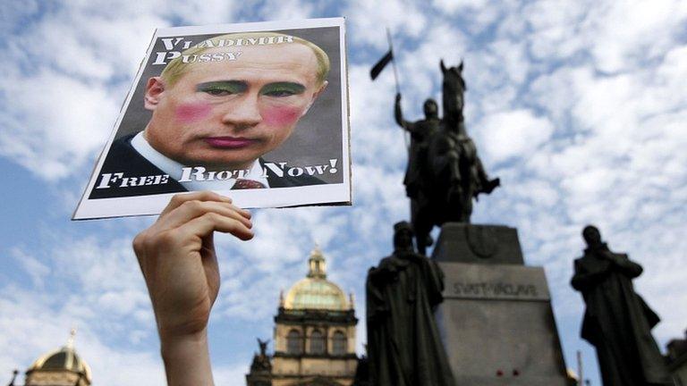 Demonstrator holding up placard protesting against the jailing of three members of Russian opposition punk group Pussy Riot in Moscow earlier on 17 August 2012