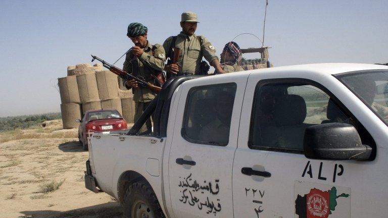 Members of the Afghan Local Police (ALP) patrol at the Char Darah district of Kunduz province