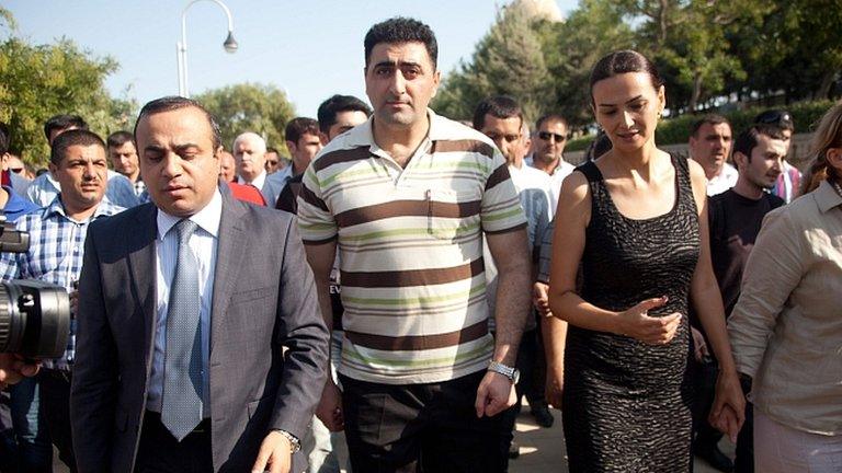 Ramil Safarov, centre, walks in the Martyrs' Alley national memorial in Baku. 31 Aug 2012