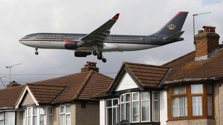 A plane flying over west London