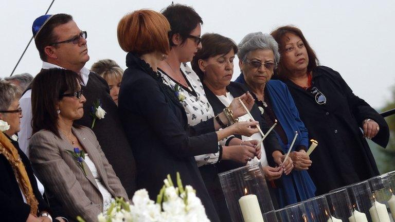 Relatives of Munich massacre victims light candles at Fuerstenfeldbruck air base in Germany, 5 September