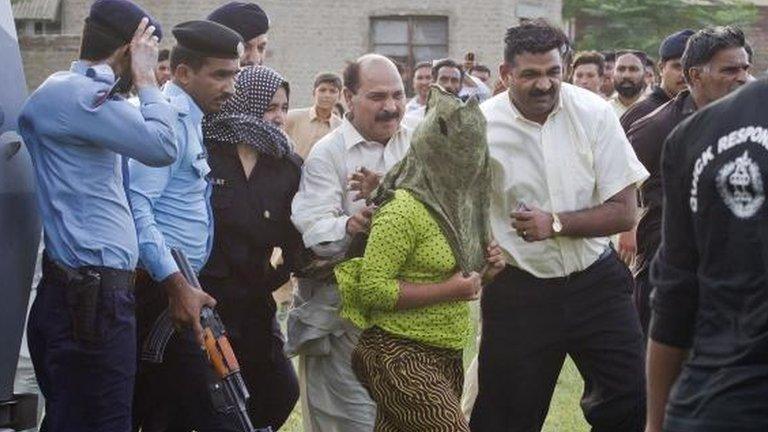 "Rimsha" is escorted to a helicopter after being released form jail in Rawalpindi, Pakistan, 8 September 2012