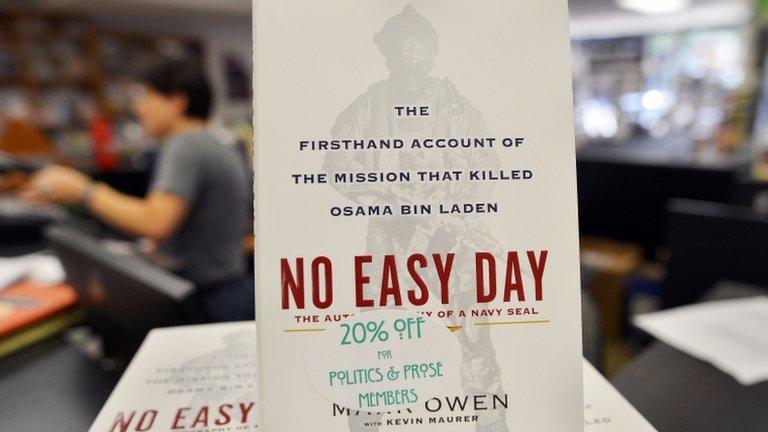 Copies of a book by former Navy SEAL titled "No Easy Day" are seen on display at a bookstore in Washington, DC