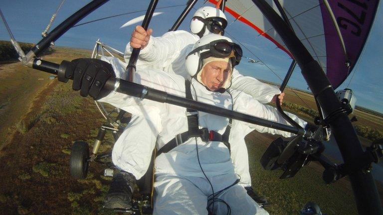 Russian President Vladimir Putin flies in a motorized hang glider alongside a Siberian white crane (image from 5 Sept)