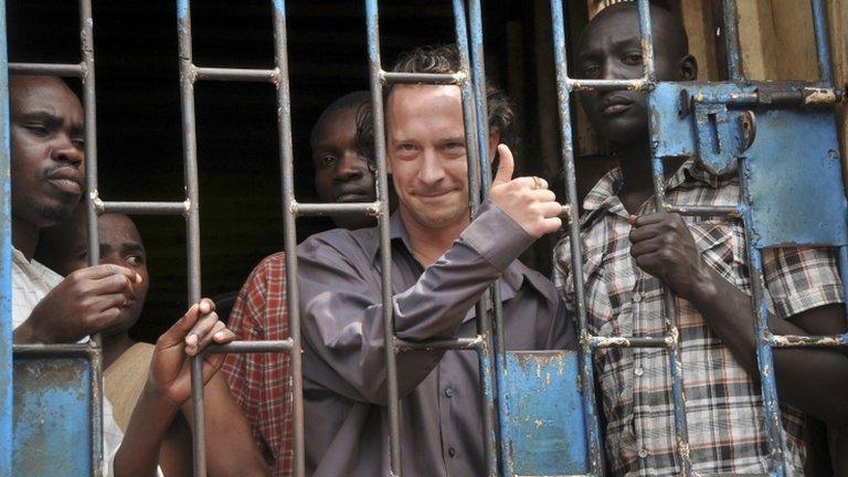 David Cecil stands in a court cell in Kampala, Uganda, 13 September 2012.