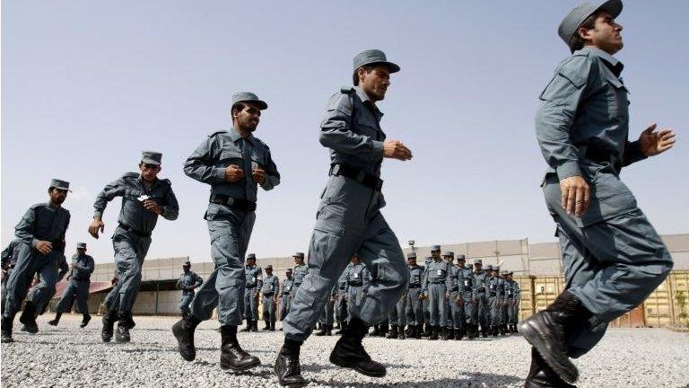 Afghan national police officers run during their graduation ceremony (file)