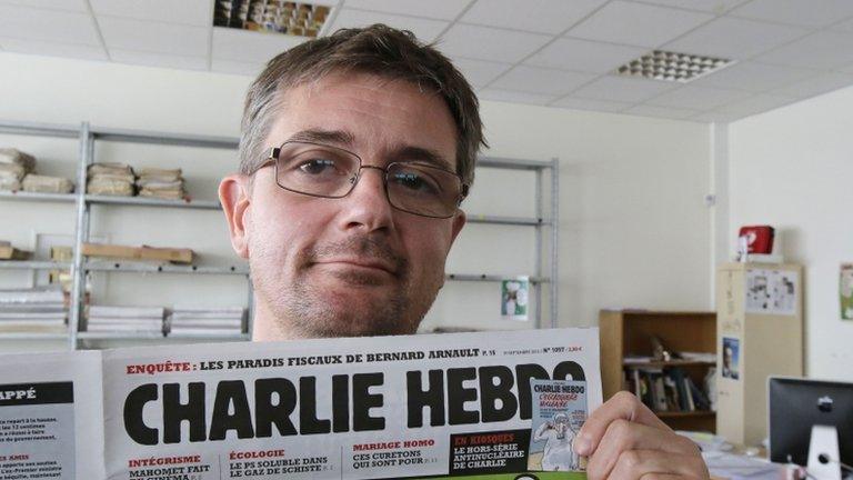 Charlie Hebdo editor Stephane Charbonnier with a copy of the newspaper