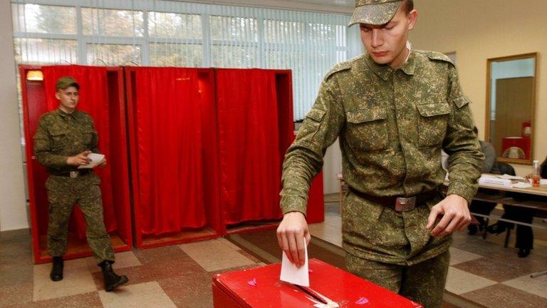 Soldiers cast their ballots during early voting for Belarus' parliamentary election in Minsk