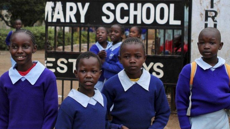 Children stand outside their primary school in Nairobi - 5 September 2012