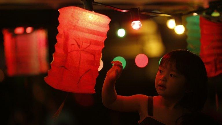 Small child and paper lantern