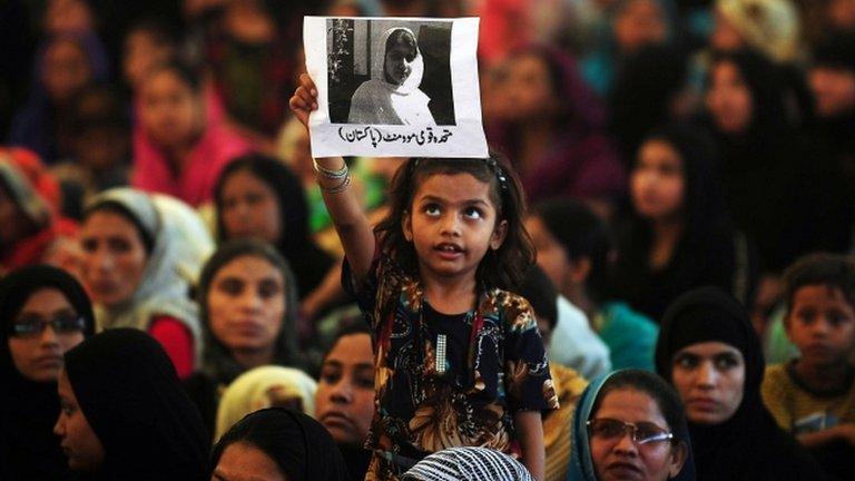 Girl holding poster of Malala