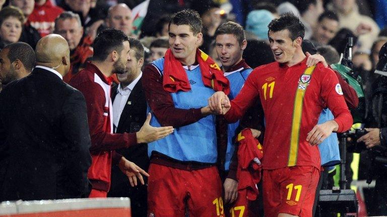 Gareth Bale receives congratulations from fans after Friday's match