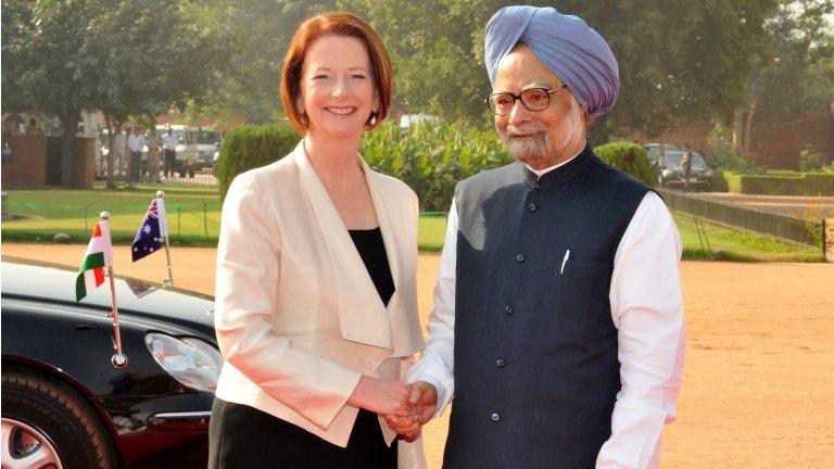 Indian Prime Minister Manmohan Singh (R) shakes hands with Australian Prime Minister Julia Gillard at the presidential palace at Rashtrapati Bhavan, in New Delhi on October 17, 2012.