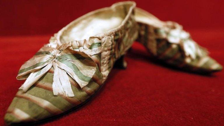 A pair of shoes which belonged to French queen Marie Antoinette appear at Paris Drouot auction house as part of a sale of "Historic memories of Royal Families"