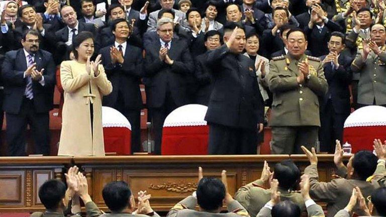 North Korean leader Kim Jong-un (C), with his wife Ri Sol-ju wearing a beige coat, watching a concert in Pyongyang, 29 October 2012