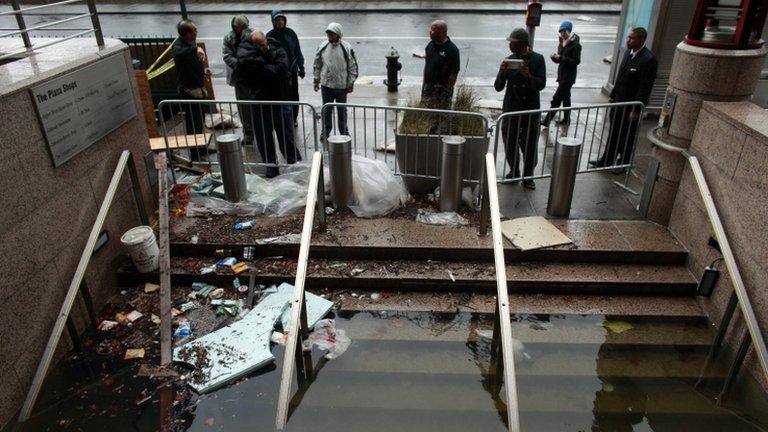 Water floods the Plaza Shops on October 30, 2012 in lower Manhattan