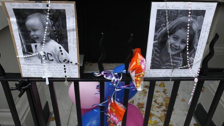 A makeshift memorial is left outside the Krim family apartment in New York