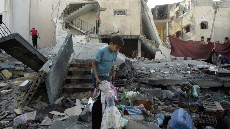 A Palestinian boy amid the rubble of a destroyed house in Rafah in the southern Gaza Strip.