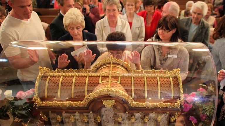 Pilgrims pray in a church in Coleshill, Warwickshire