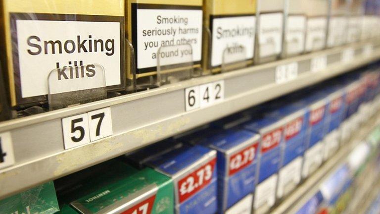 Cigarettes displayed in cabinet