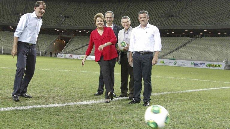 Brazilian President Dilma Rousseff kicks a ball in the Castelao Arena on 16 December