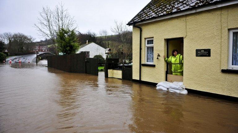 The river Bray in Brayford, Devon, has burst its banks